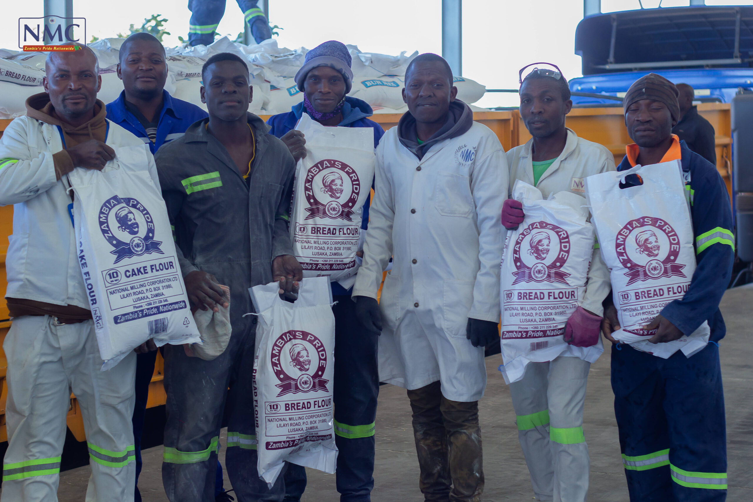 NMC production employees proudly displaying Zambia’s Pride flour