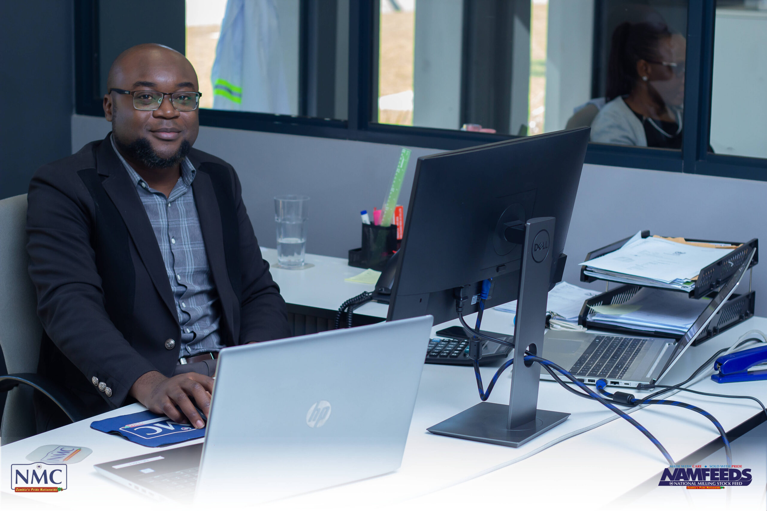 An NMC team member at work in the company office